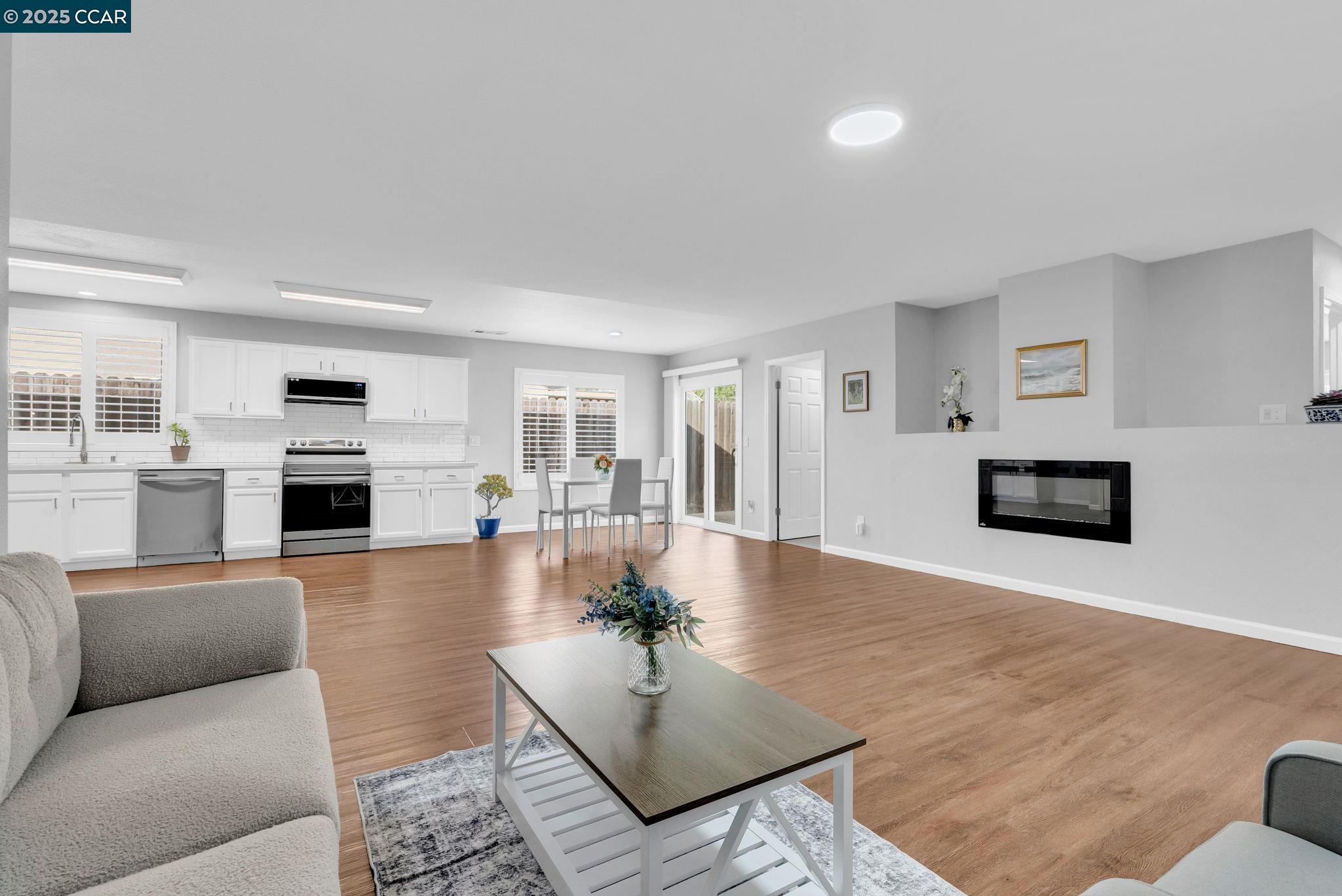 432 Red Robin Drive Patterson, CA 95363 - Photo 14 of 47 a living room with furniture and a flat screen tv