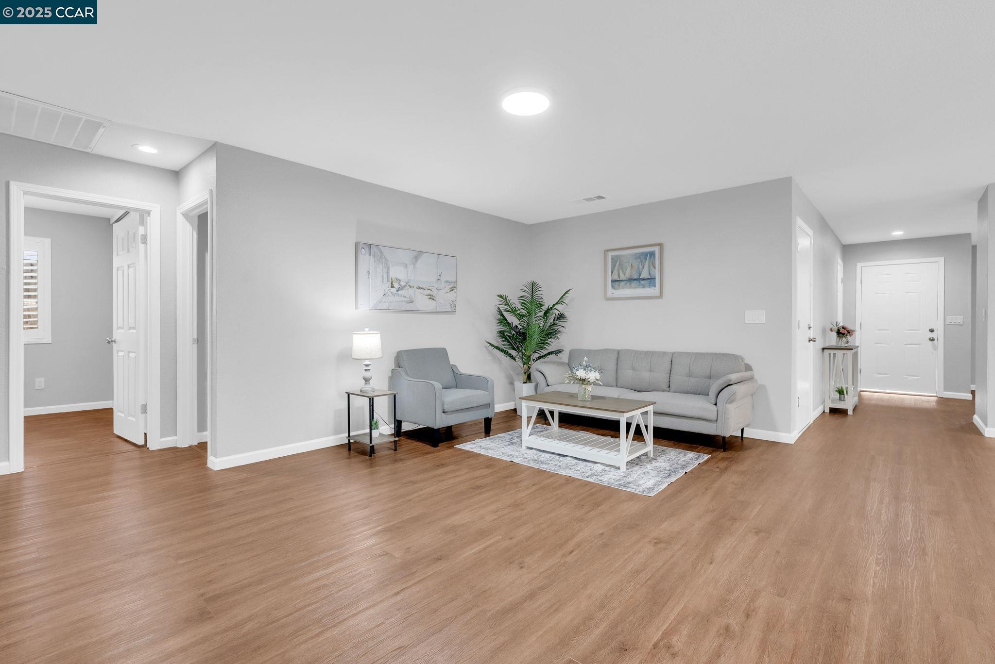 432 Red Robin Drive Patterson, CA 95363 - Photo 15 of 47 a living room with furniture and a wooden floor