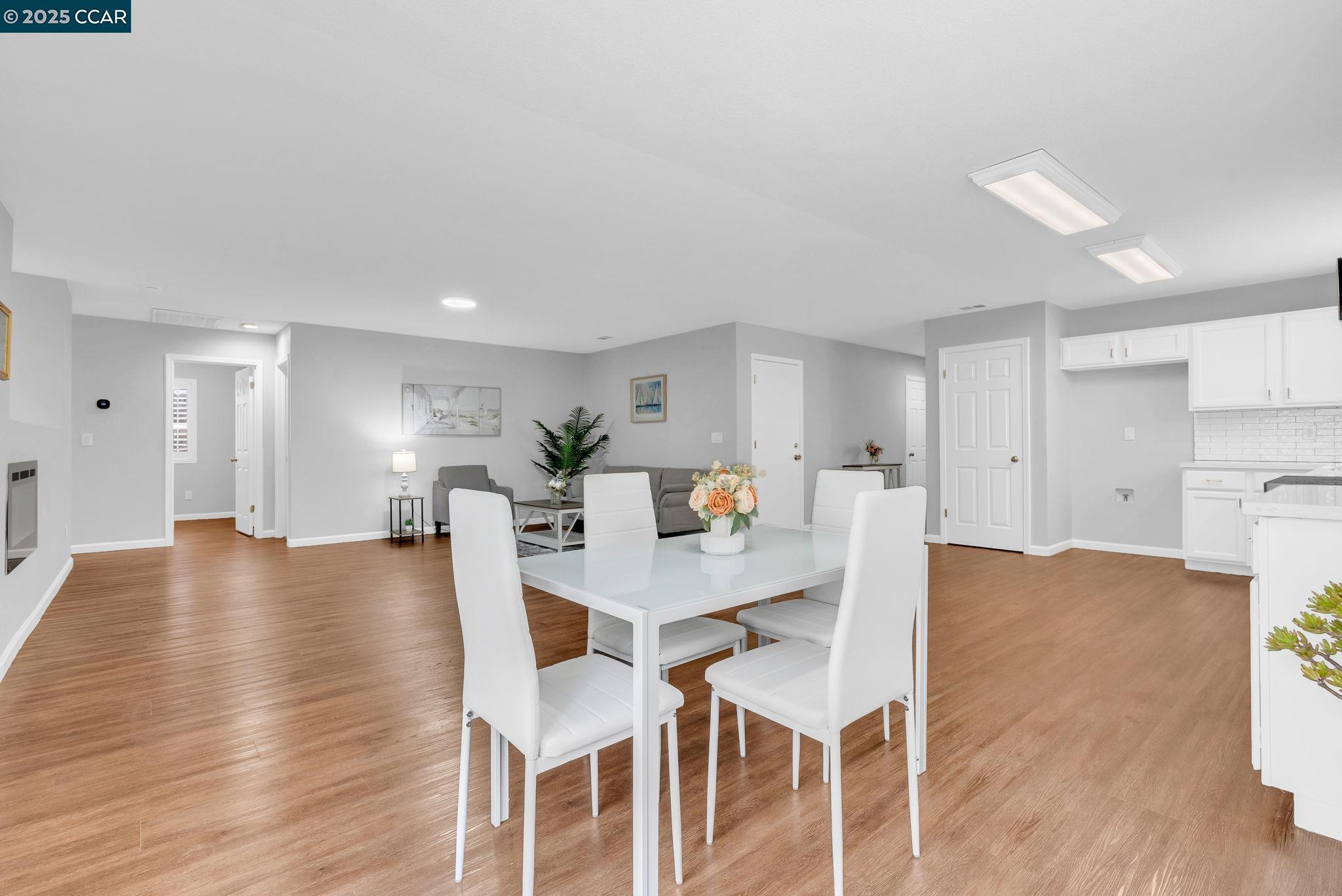 432 Red Robin Drive Patterson, CA 95363 - Photo 18 of 47 a view of a dining room with furniture and wooden floor