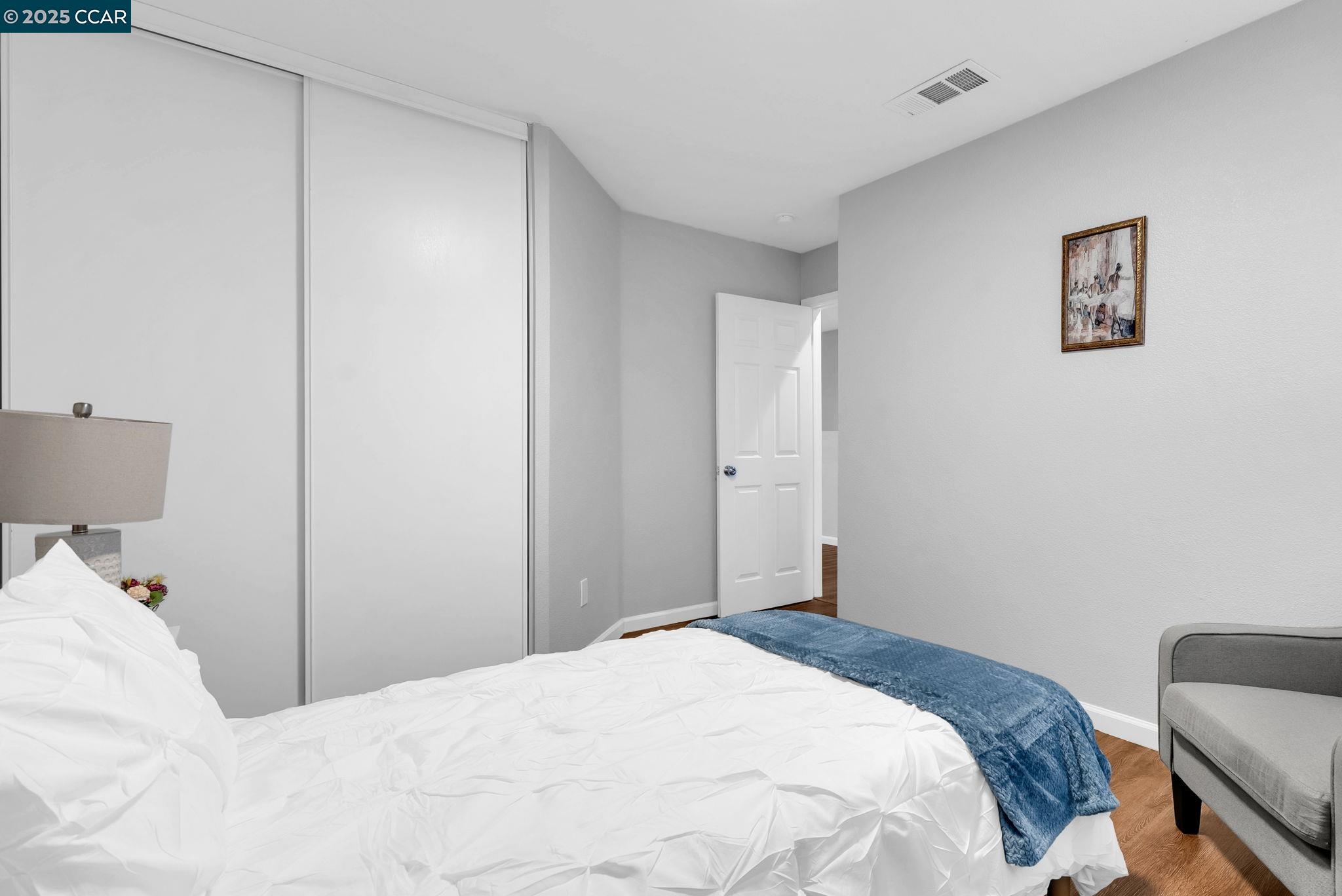 432 Red Robin Drive Patterson, CA 95363 - Photo 24 of 47 a bedroom with a bed and a couch