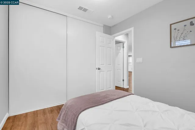 a bedroom with a bed and a shower