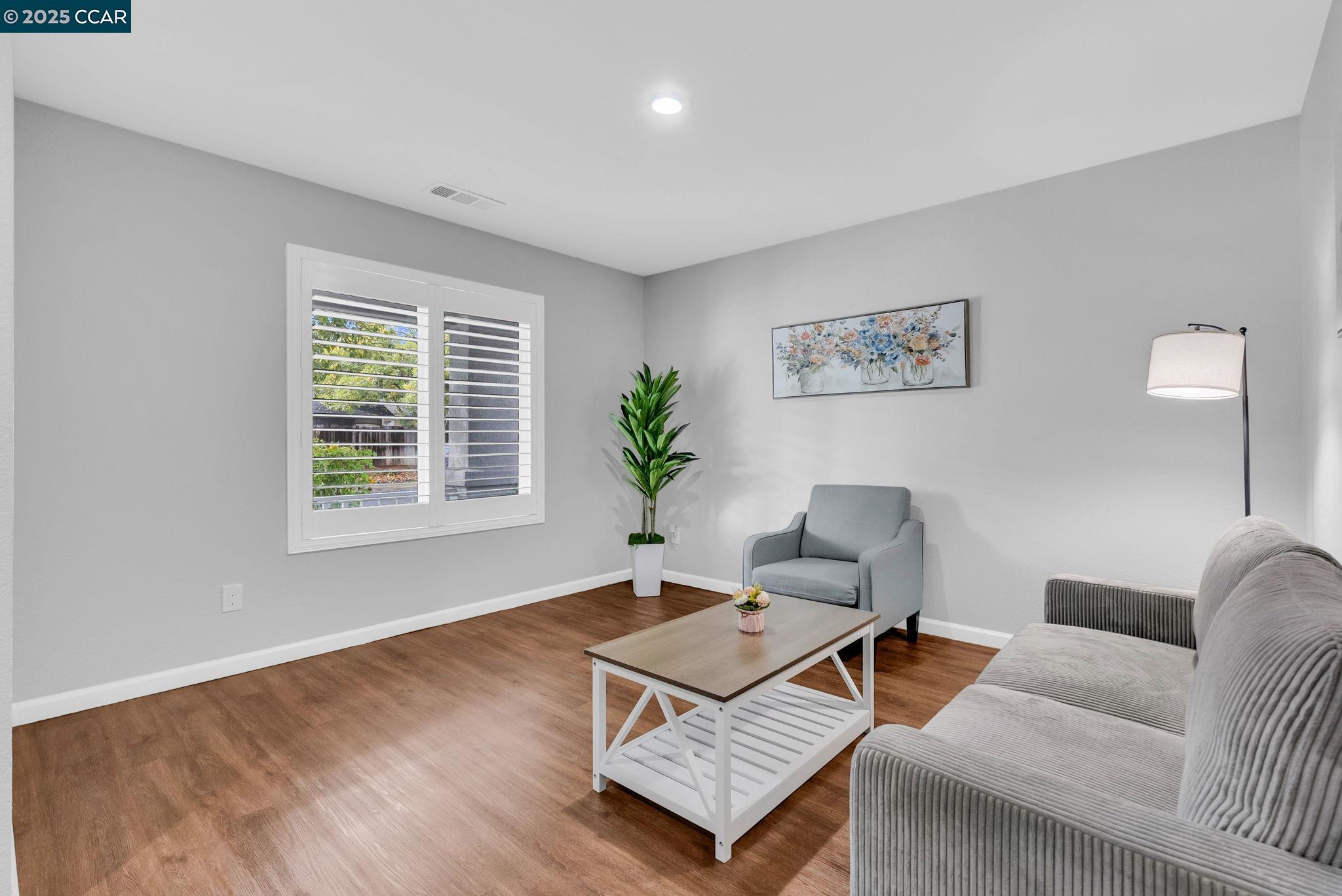 432 Red Robin Drive Patterson, CA 95363 - Photo 3 of 47 a living room with furniture and a window