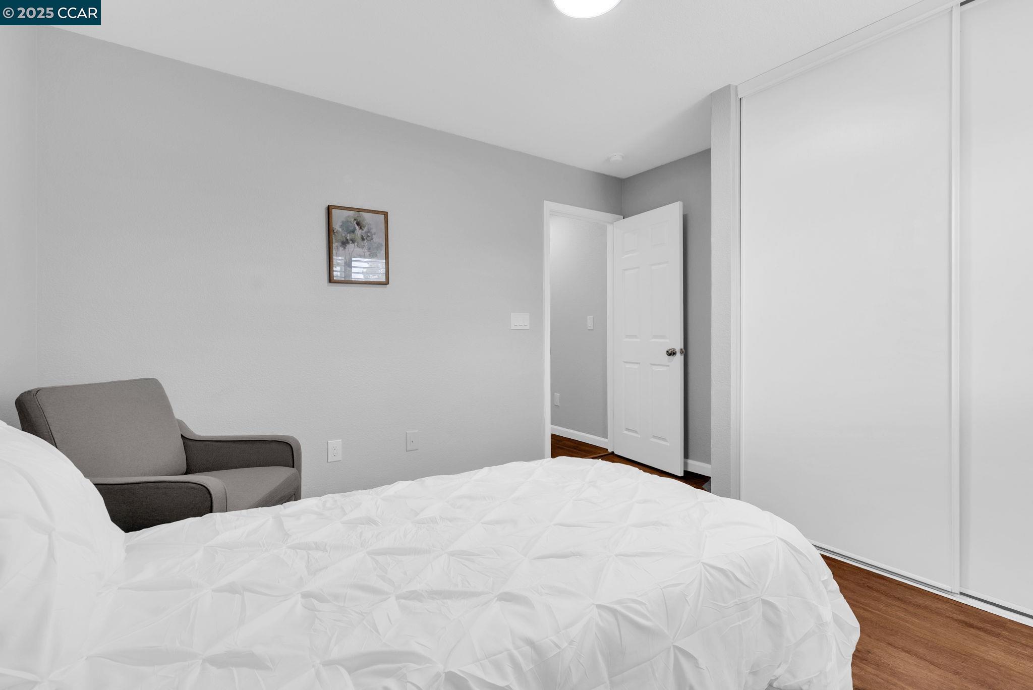 432 Red Robin Drive Patterson, CA 95363 - Photo 34 of 47 a bedroom with a bed and a chair