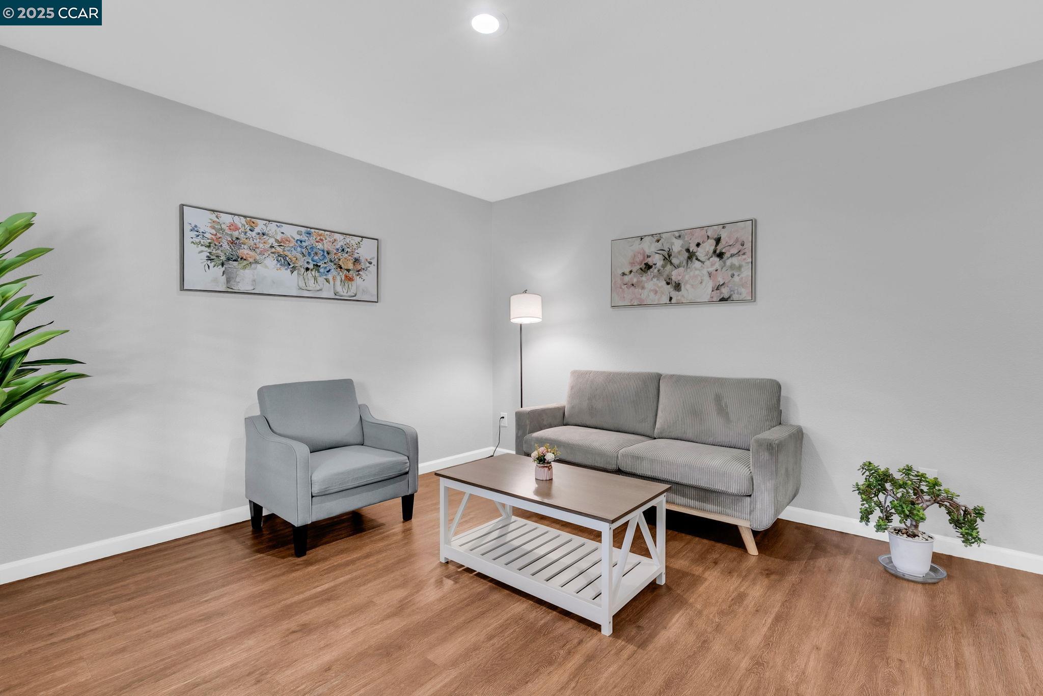 432 Red Robin Drive Patterson, CA 95363 - Photo 4 of 47 a living room with furniture and a wooden floor