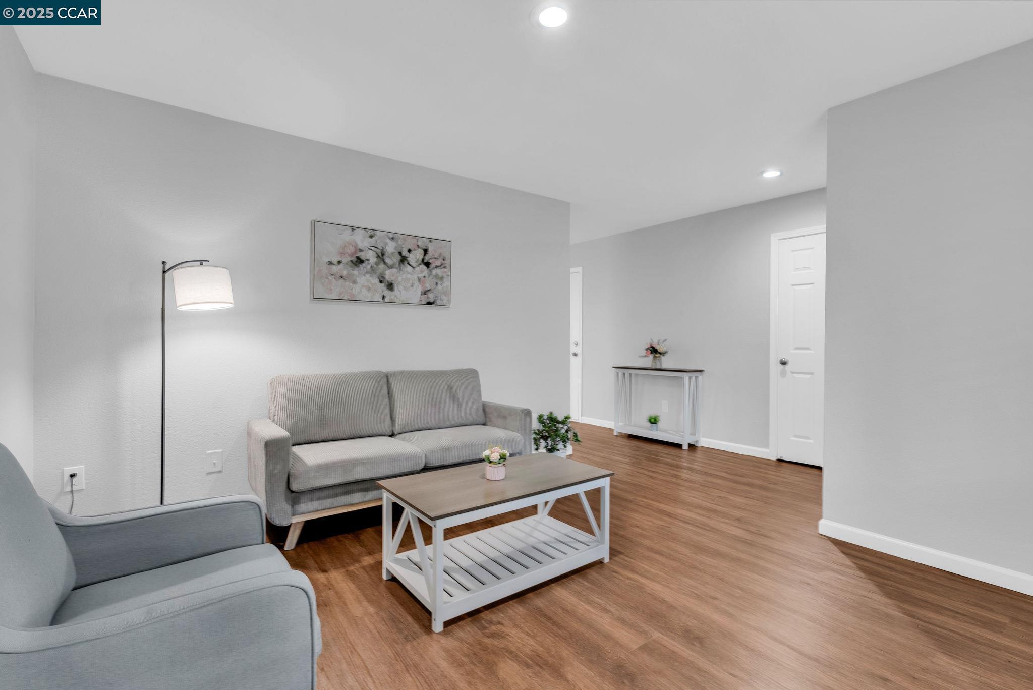 432 Red Robin Drive Patterson, CA 95363 - Photo 5 of 47 a living room with furniture and a wooden floor