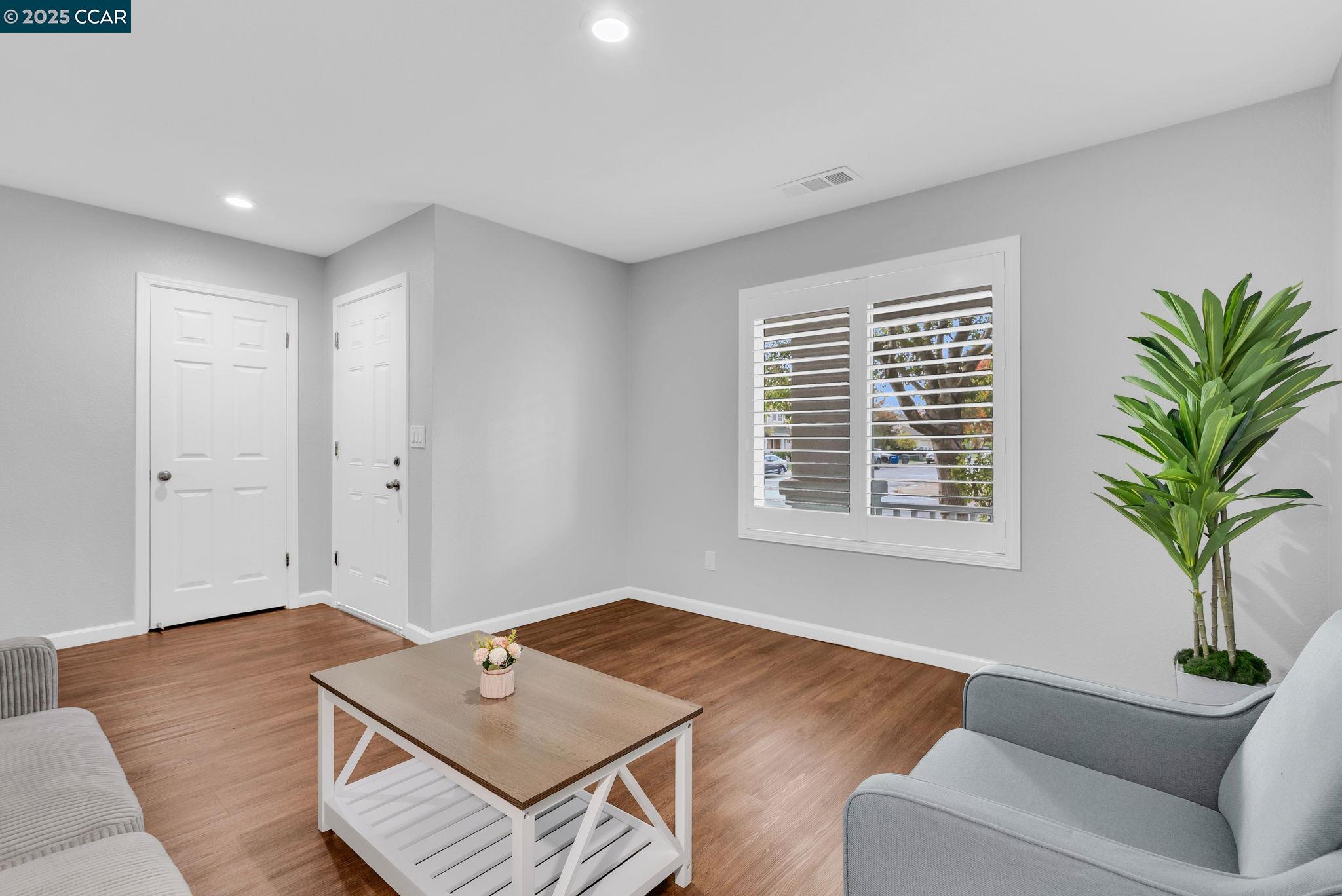 432 Red Robin Drive Patterson, CA 95363 - Photo 6 of 47 a living room with furniture and a window