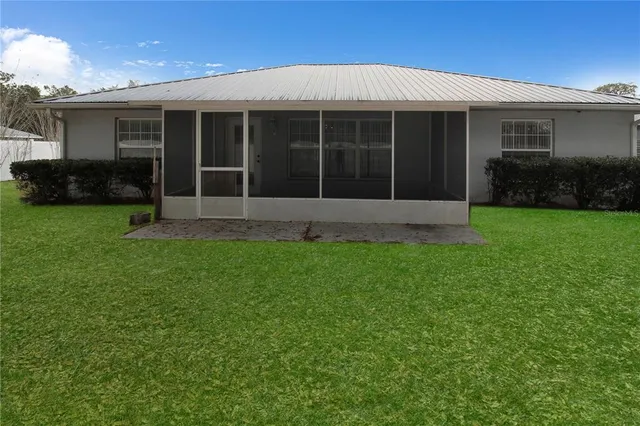 a view of house with yard and garden