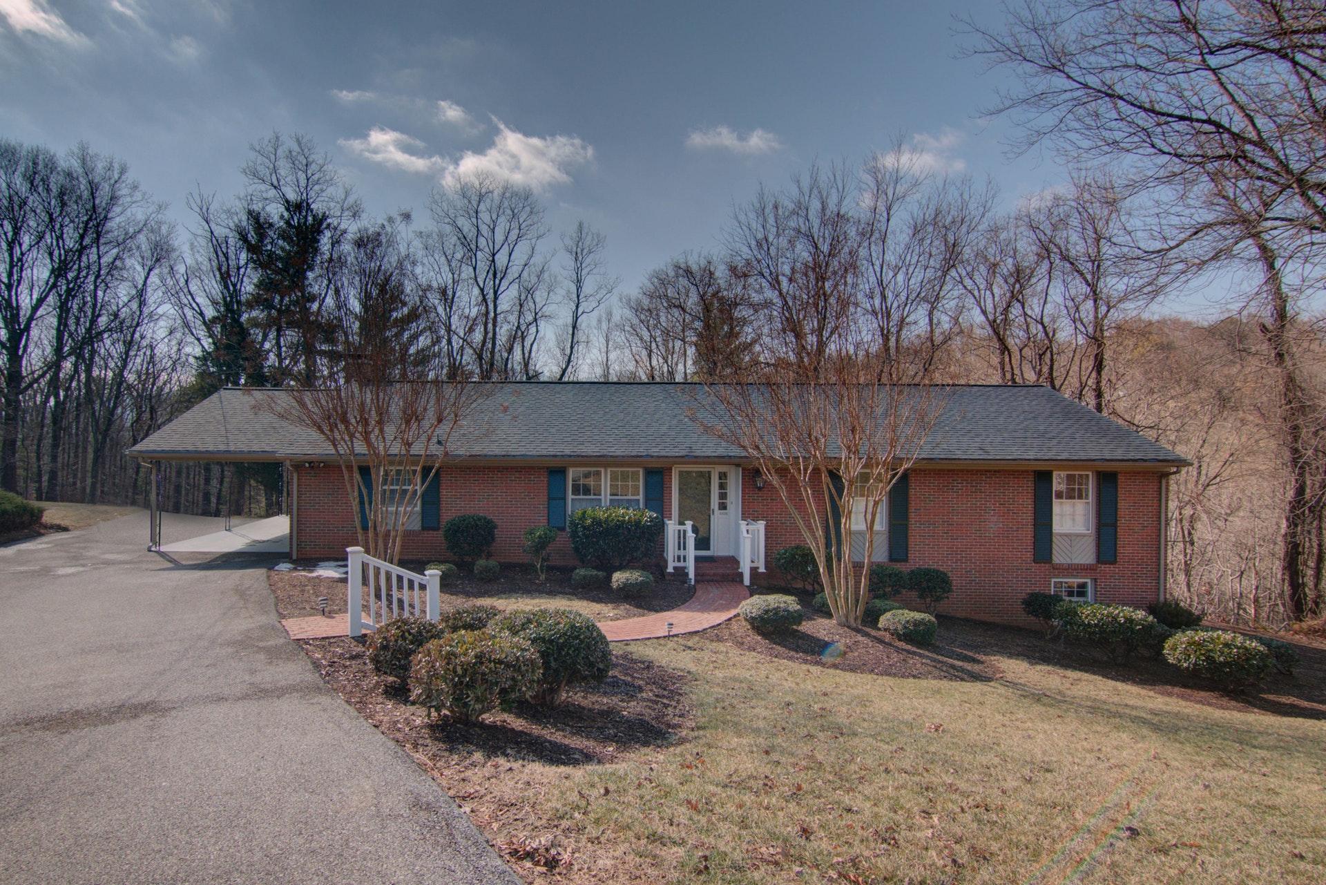 4606 Rosecrest Road Roanoke, VA 24018 - Photo 1 of 28 a front view of a house with garden and trees