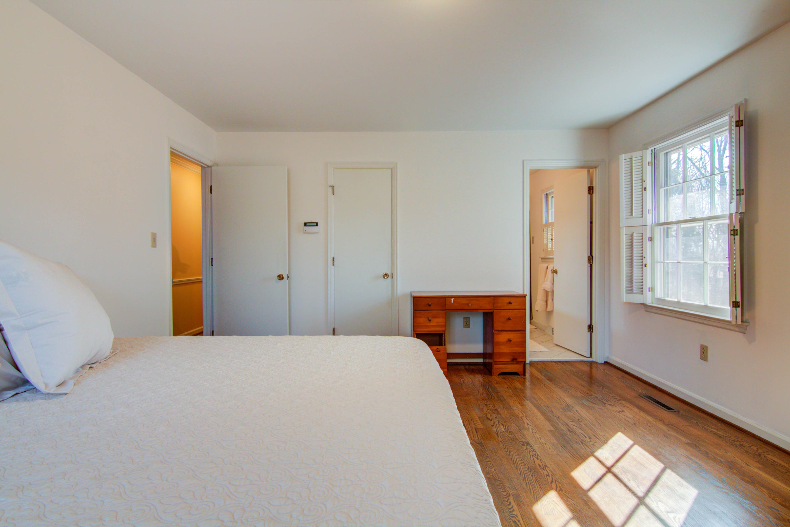 4606 Rosecrest Road Roanoke, VA 24018 - Photo 12 of 28 a bedroom with a bed and wooden floor