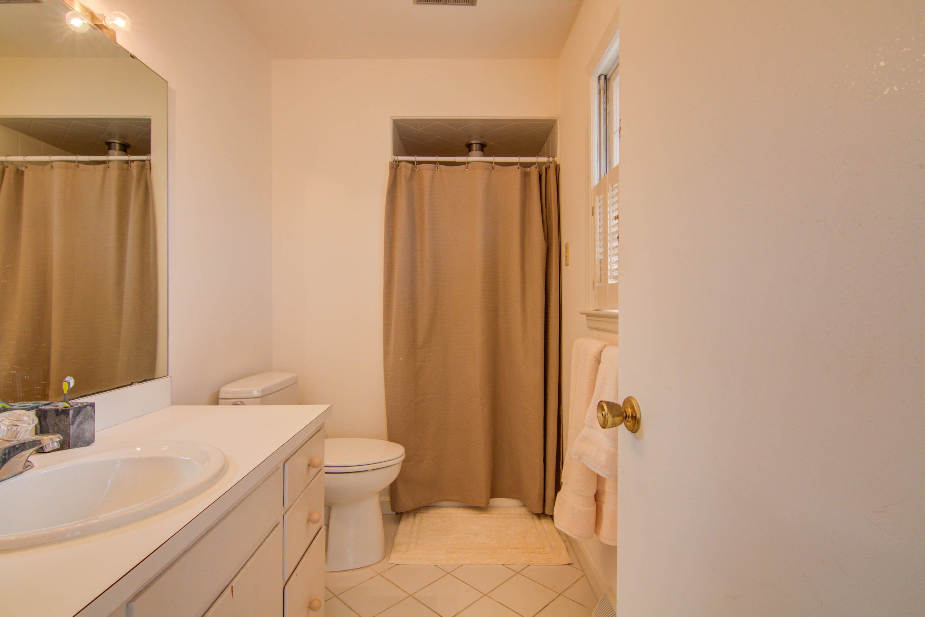 4606 Rosecrest Road Roanoke, VA 24018 - Photo 13 of 28 a bathroom with a granite countertop sink toilet and shower