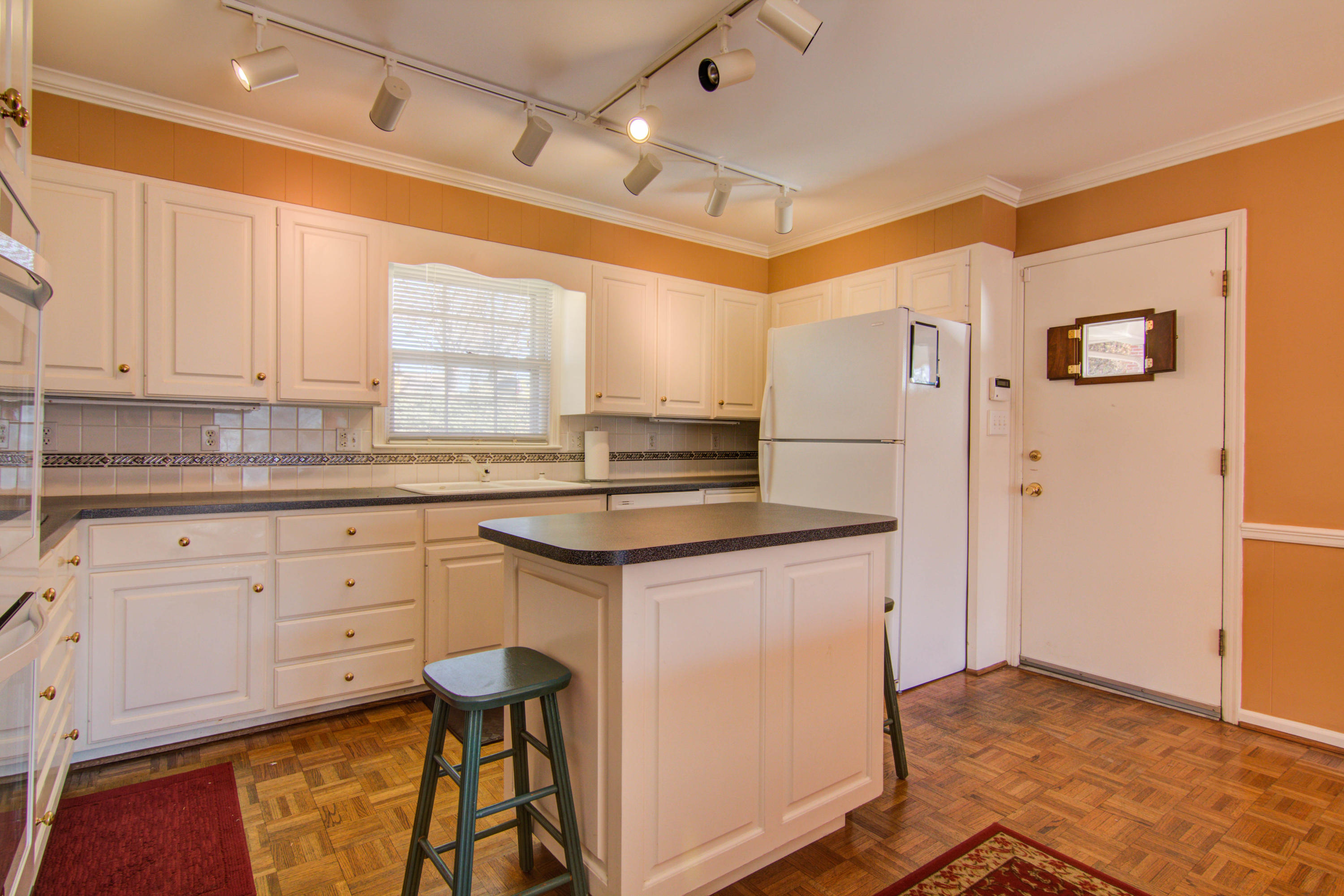 4606 Rosecrest Road Roanoke, VA 24018 - Photo 16 of 28 a kitchen with stainless steel appliances granite countertop a stove a sink and a refrigerator