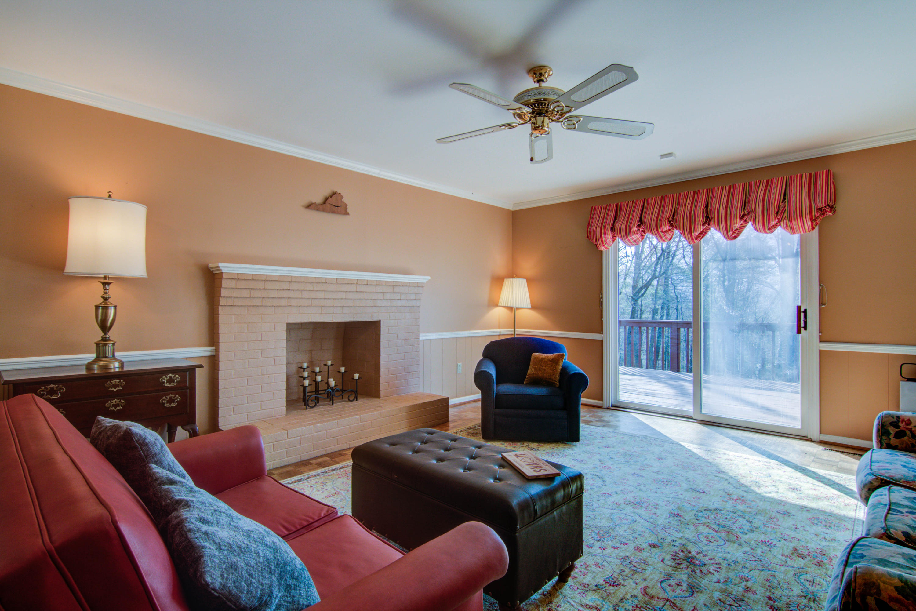 4606 Rosecrest Road Roanoke, VA 24018 - Photo 17 of 28 a living room with furniture a ceiling fan and a fireplace