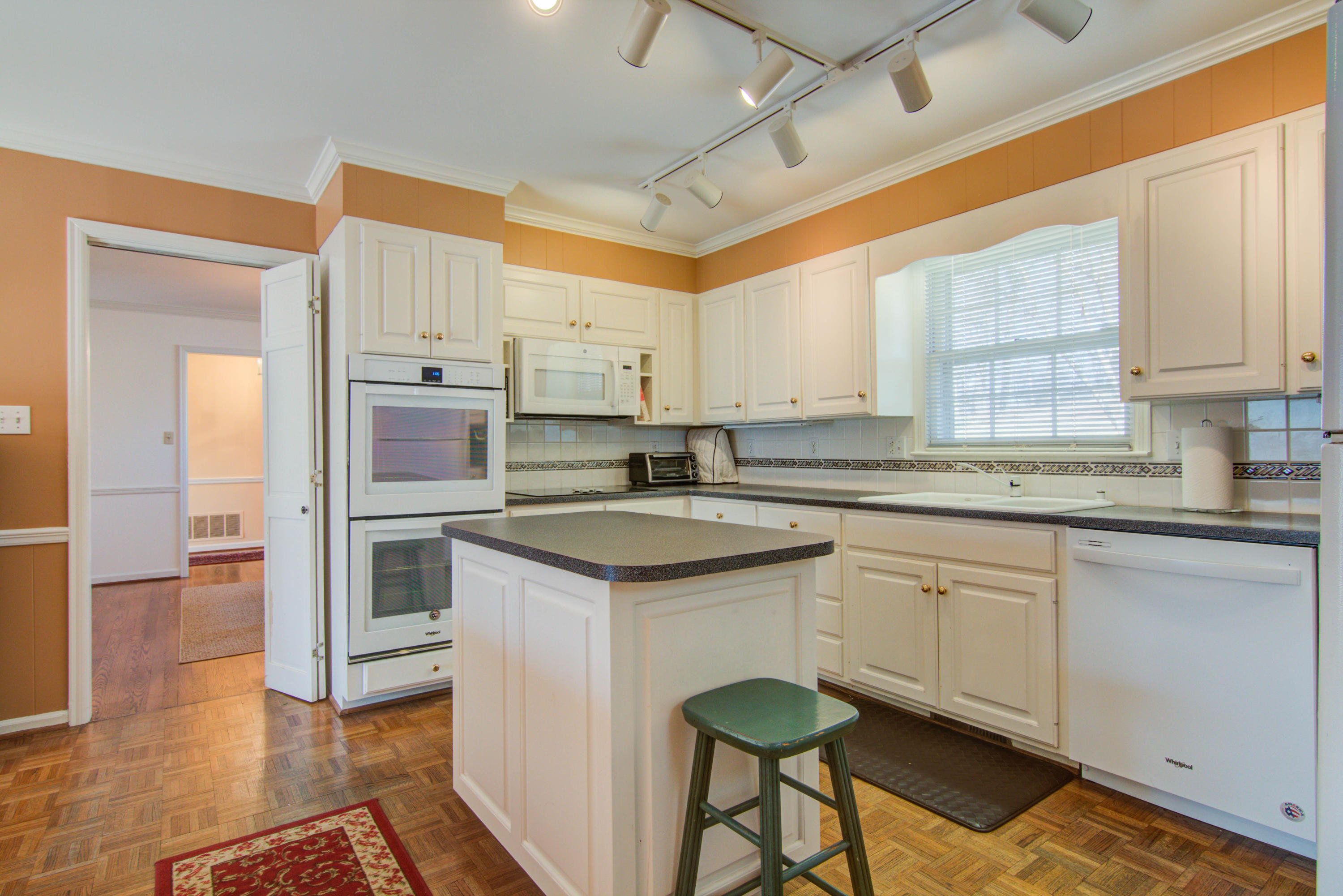 4606 Rosecrest Road Roanoke, VA 24018 - Photo 18 of 28 a kitchen with granite countertop a sink stove and cabinets