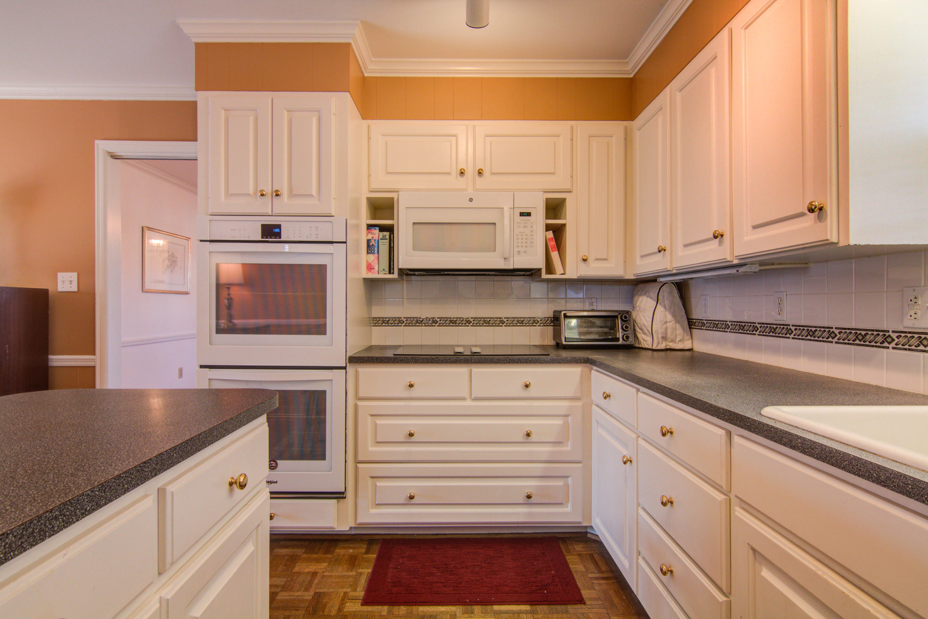 4606 Rosecrest Road Roanoke, VA 24018 - Photo 19 of 28 a kitchen with granite countertop white cabinets and stainless steel appliances