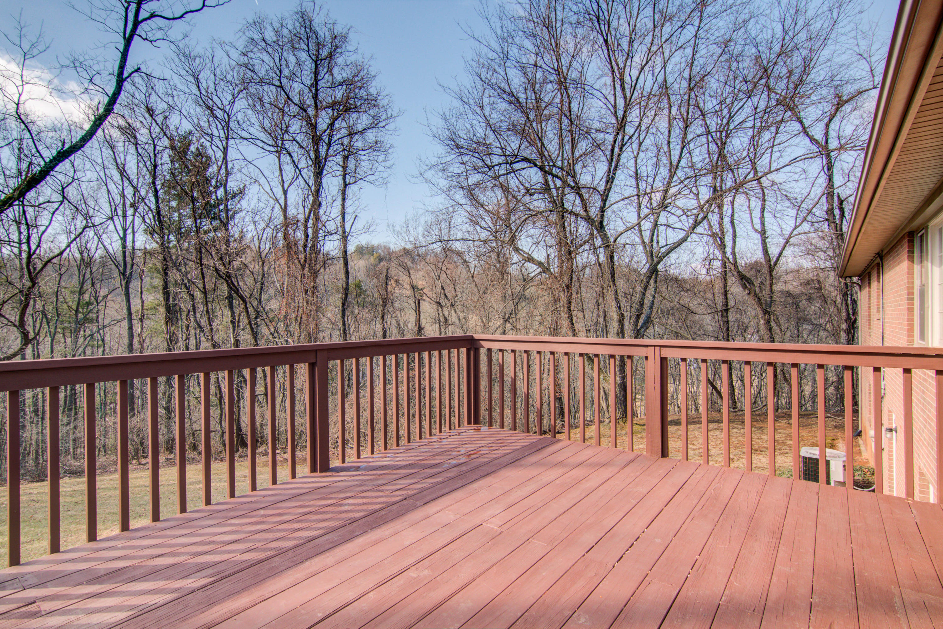 4606 Rosecrest Road Roanoke, VA 24018 - Photo 20 of 28 a balcony with wooden floor and fence