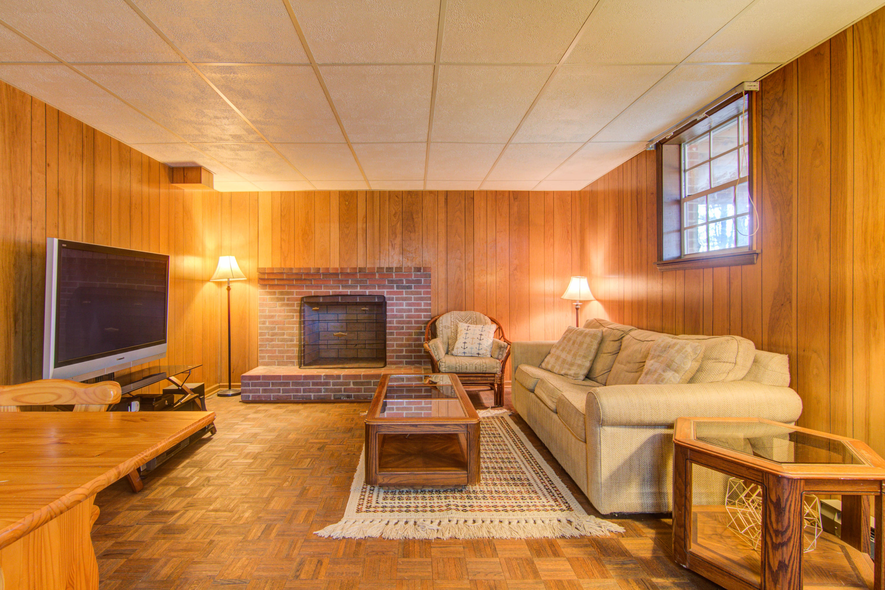 4606 Rosecrest Road Roanoke, VA 24018 - Photo 23 of 28 a living room with furniture a flat screen tv and a fireplace
