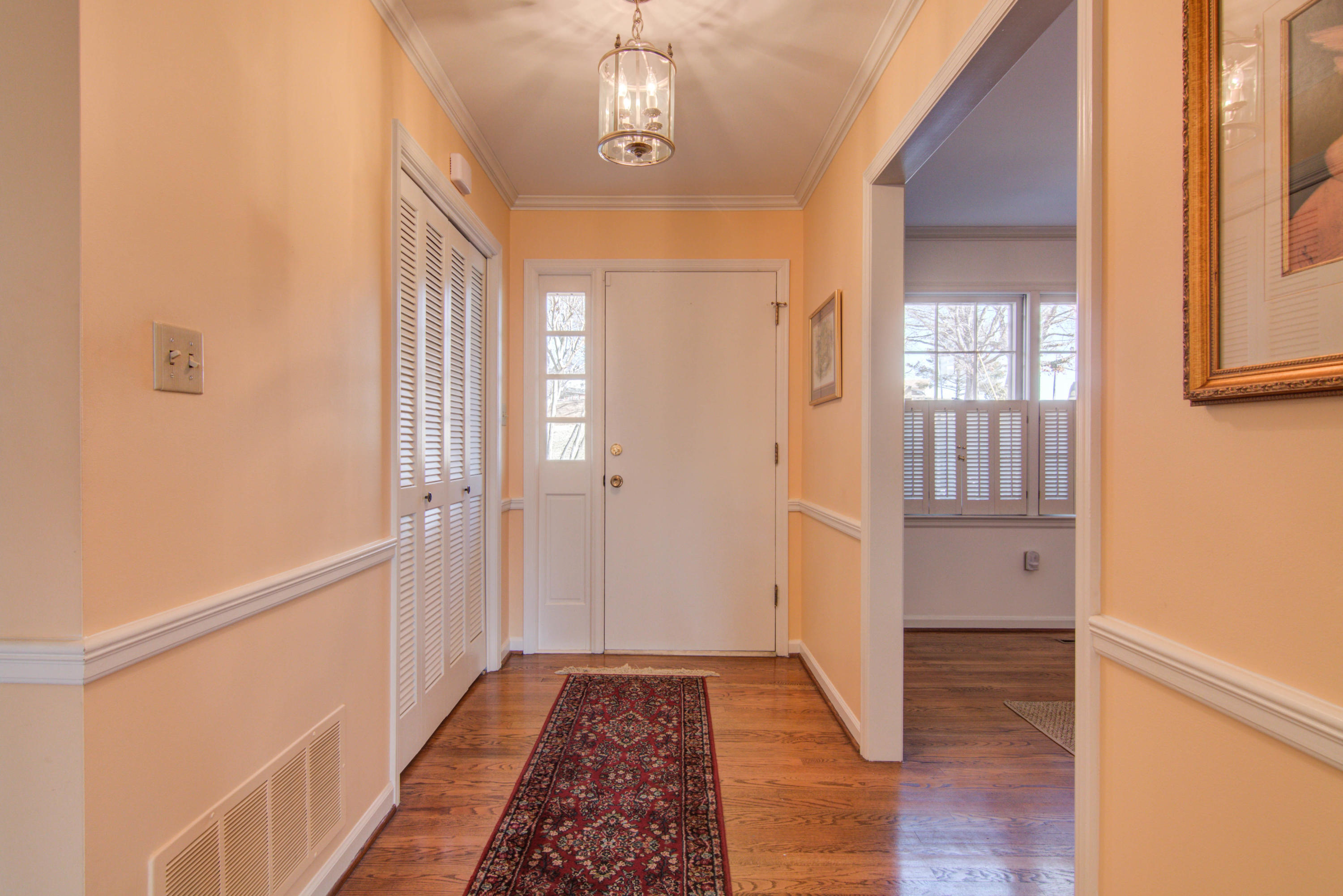 4606 Rosecrest Road Roanoke, VA 24018 - Photo 4 of 28 a view of hallway with window and wooden floor