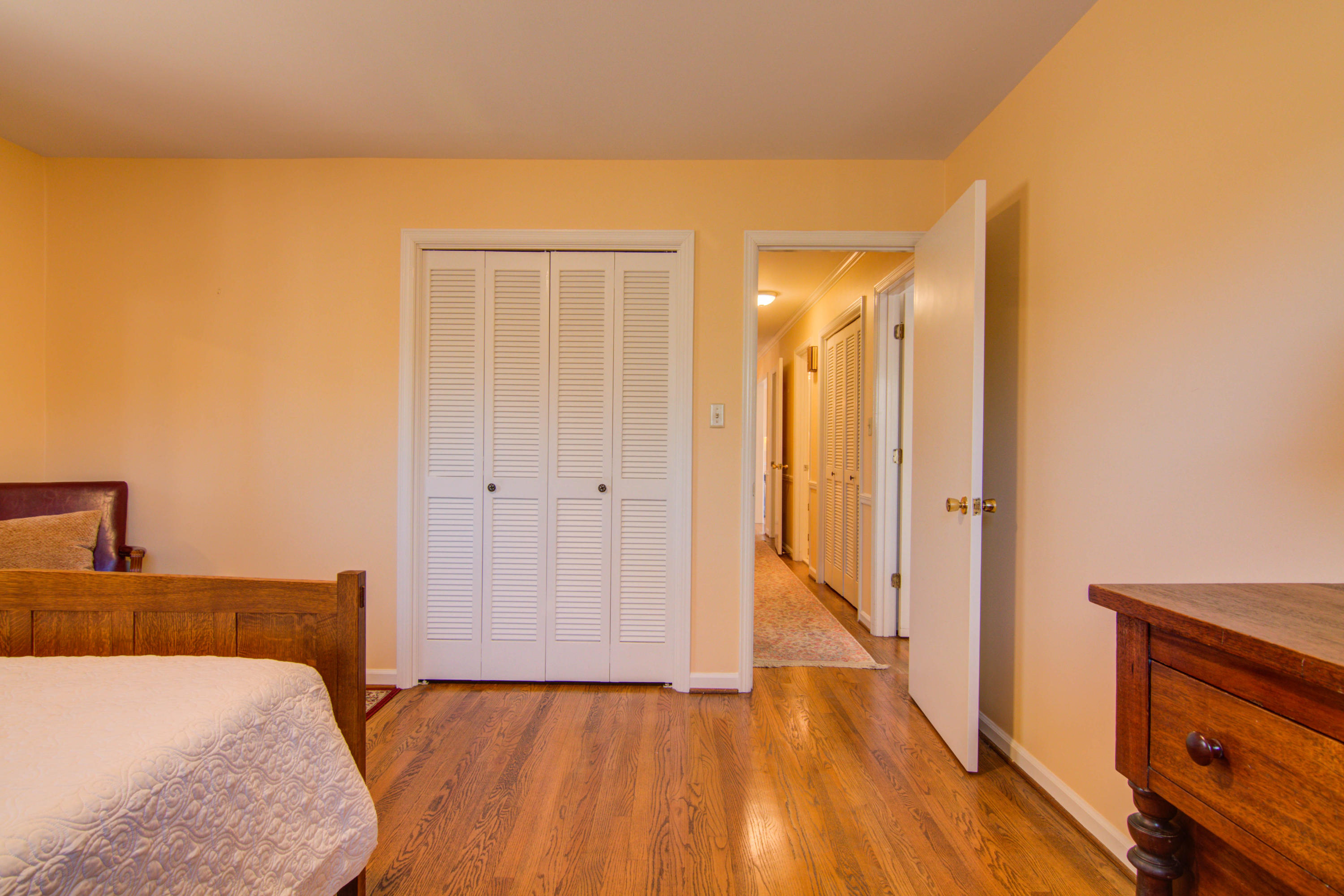 4606 Rosecrest Road Roanoke, VA 24018 - Photo 10 of 28 a view of a bedroom with wooden floor and bathroom