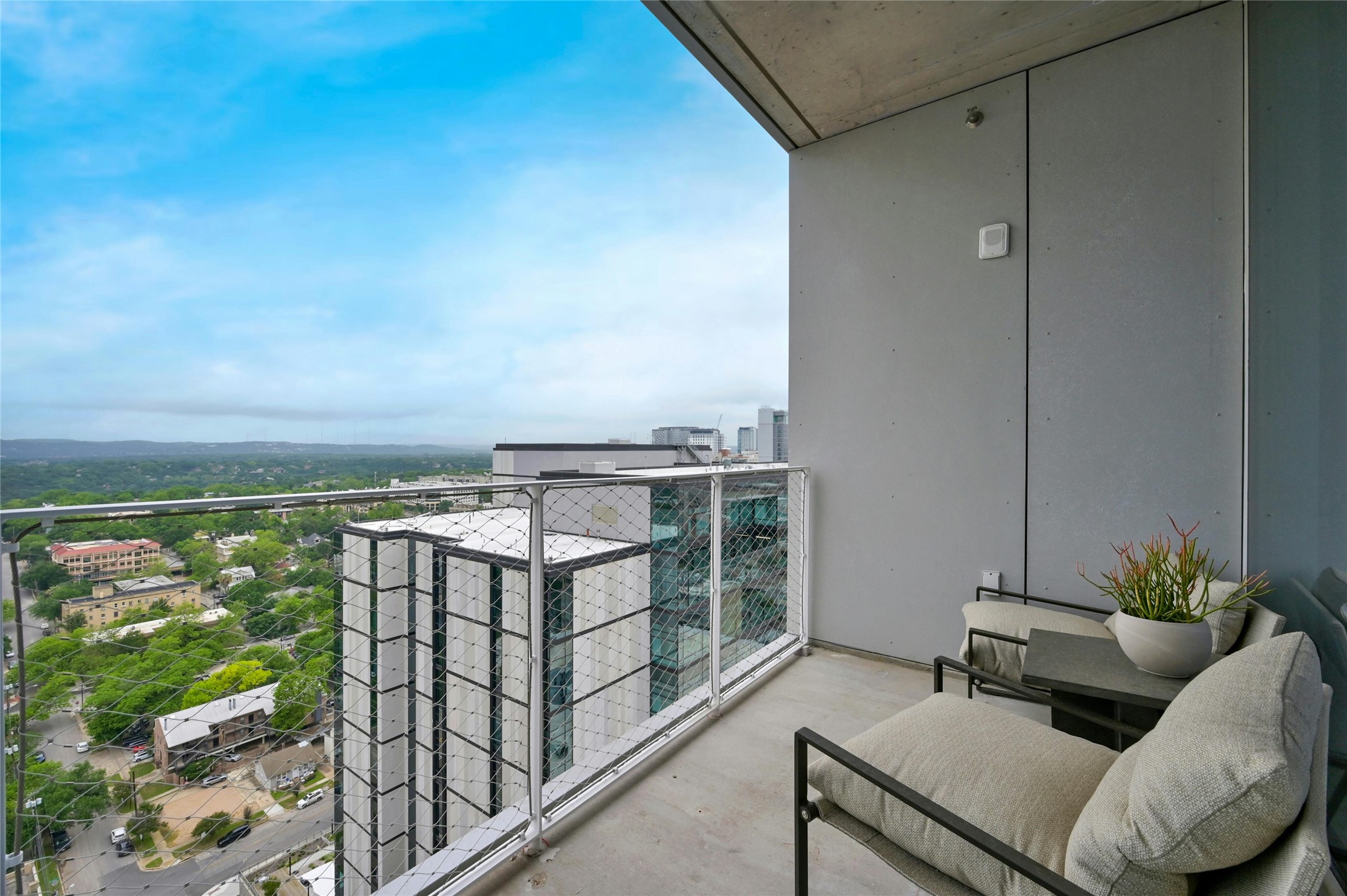 313 West 17th Street, Unit 2204 Austin, TX 78701 - Photo 20 of 40 Private balcony with seamless indoor-outdoor flow, ideal for entertaining or relaxing while taking in sweeping views over the city.