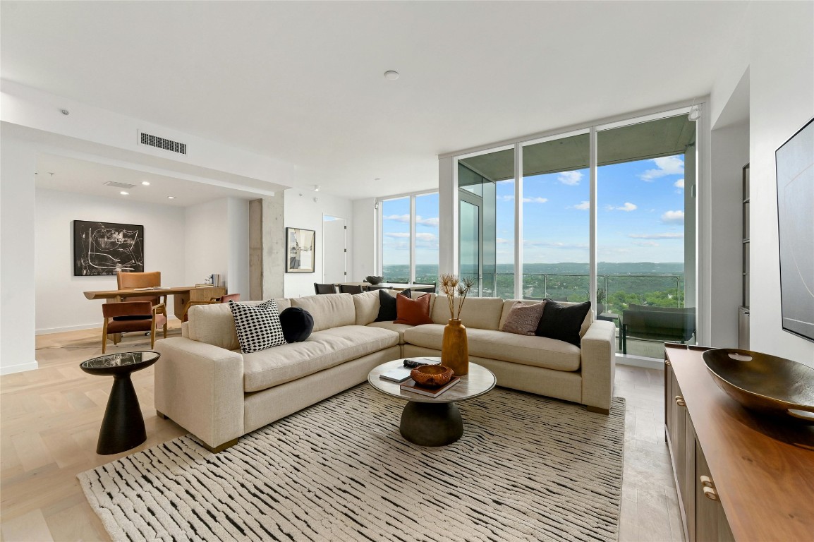 313 West 17th Street, Unit 2204 Austin, TX 78701 - Photo 2 of 40 a living room with furniture and a large window