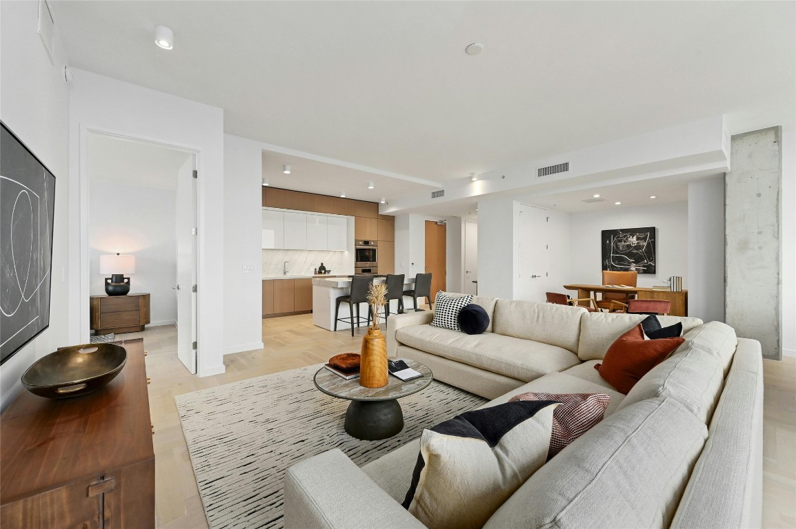 313 West 17th Street, Unit 2204 Austin, TX 78701 - Photo 7 of 40 a living room with furniture and a large window