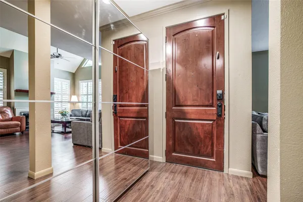 a view of entryway with wooden floor