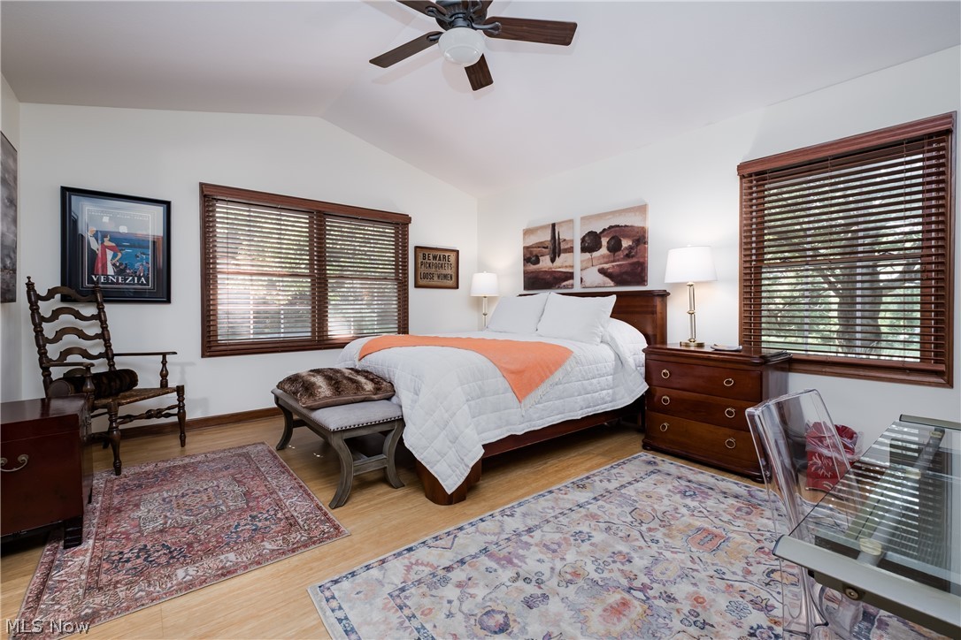 3151 Perry Drive Northwest Canton, OH 44708 - Photo 33 of 49 Bedroom featuring vaulted ceiling, wood finished floors, and a ceiling fan