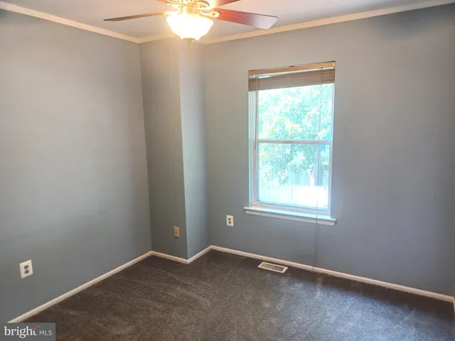 a view of empty room with empty racks