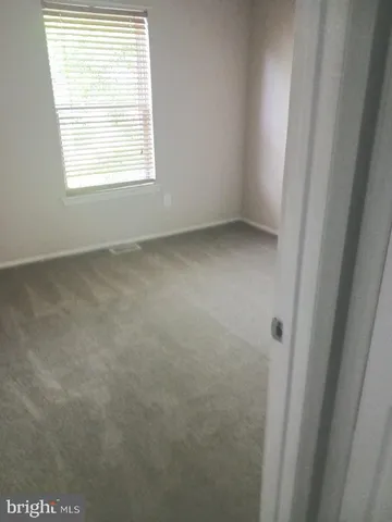 a white toilet sitting next to a white sink