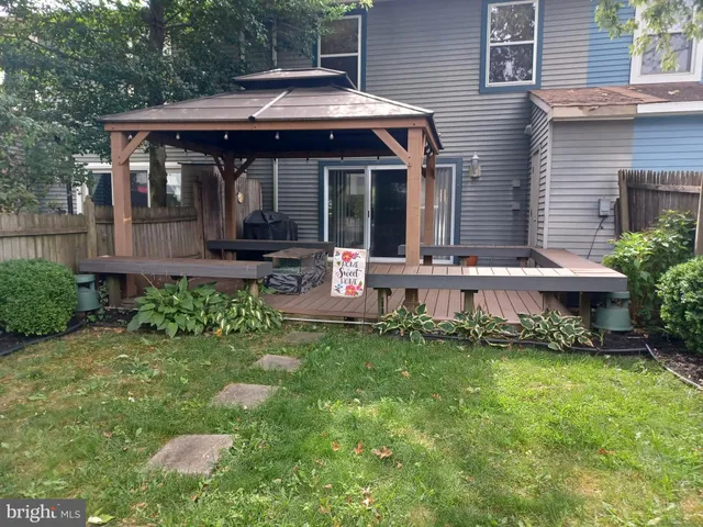 a view of a house with a yard and plants