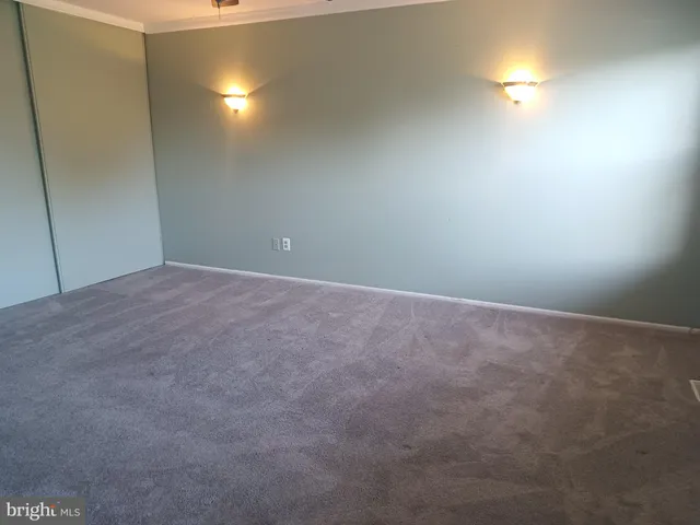a white toilet sitting next to a bath tub