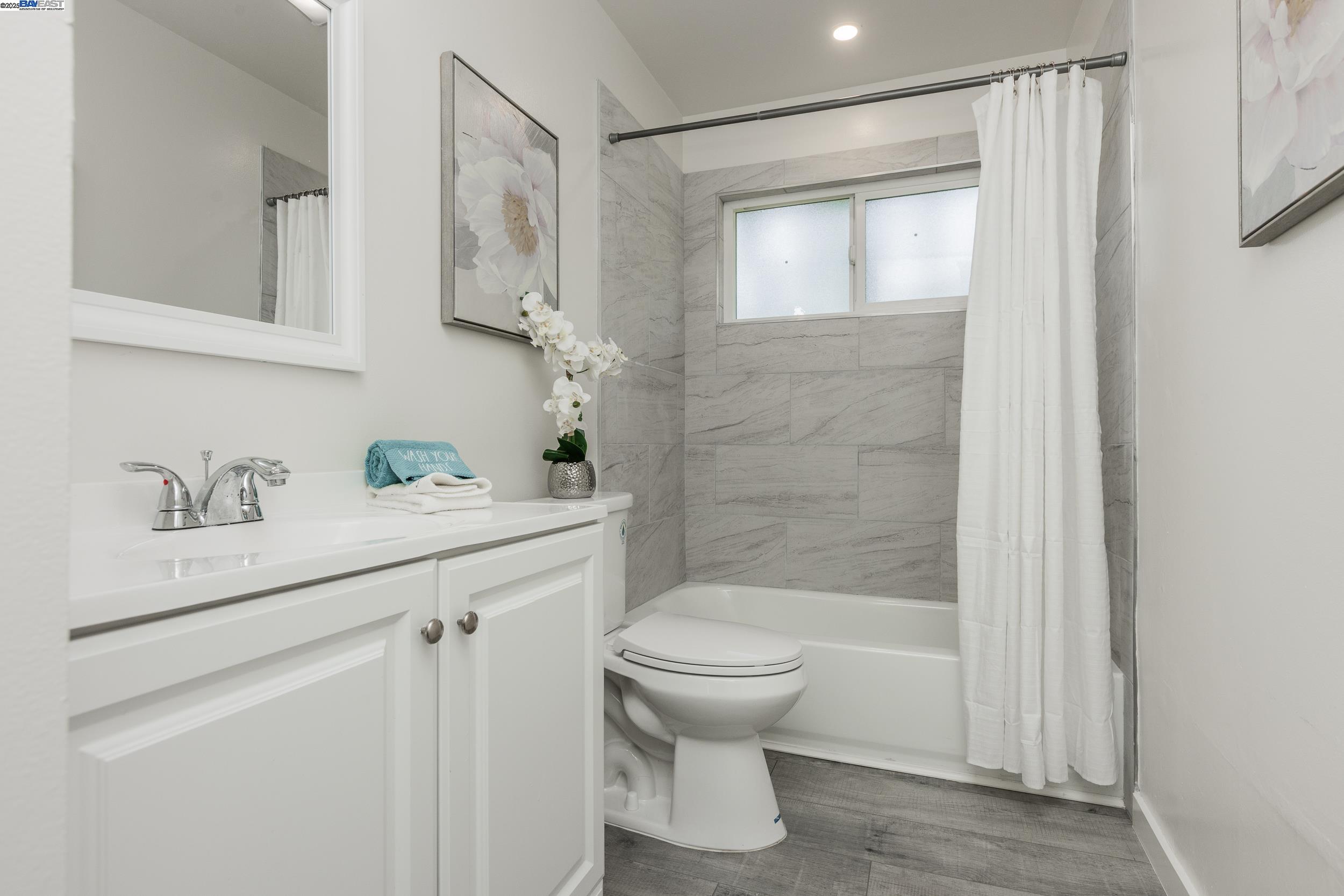 1965 Ascot Drive, Unit 6 Moraga, CA 94556 - Photo 14 of 25 a bathroom with a sink toilet and shower