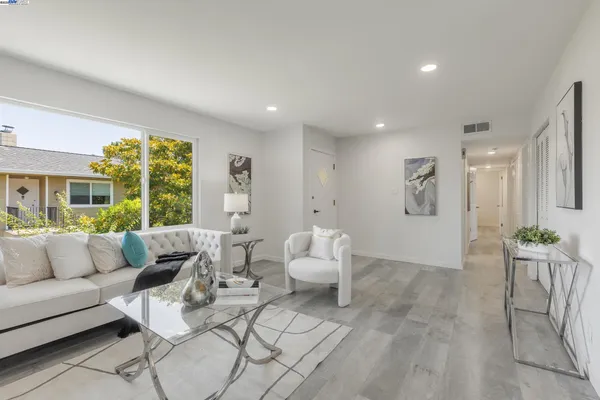 a living room with furniture and a large window