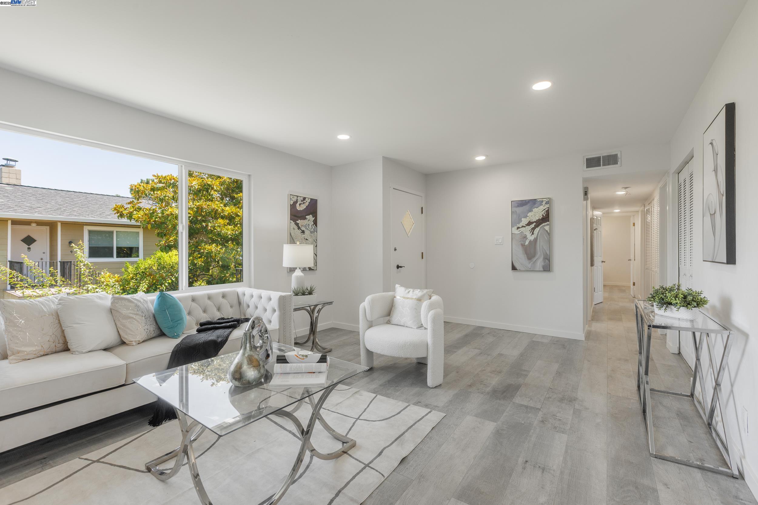 1965 Ascot Drive, Unit 6 Moraga, CA 94556 - Photo 2 of 25 a living room with furniture and a large window