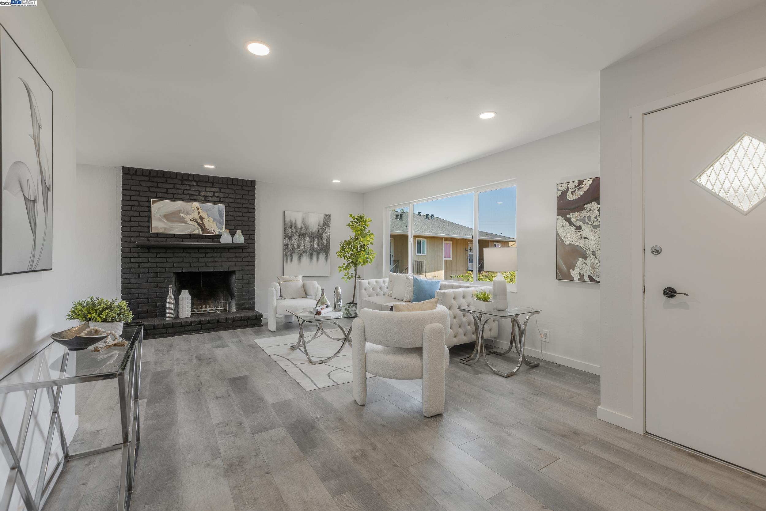 1965 Ascot Drive, Unit 6 Moraga, CA 94556 - Photo 3 of 25 a living room with furniture large window and fireplace