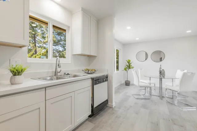 a kitchen with a sink and cabinets