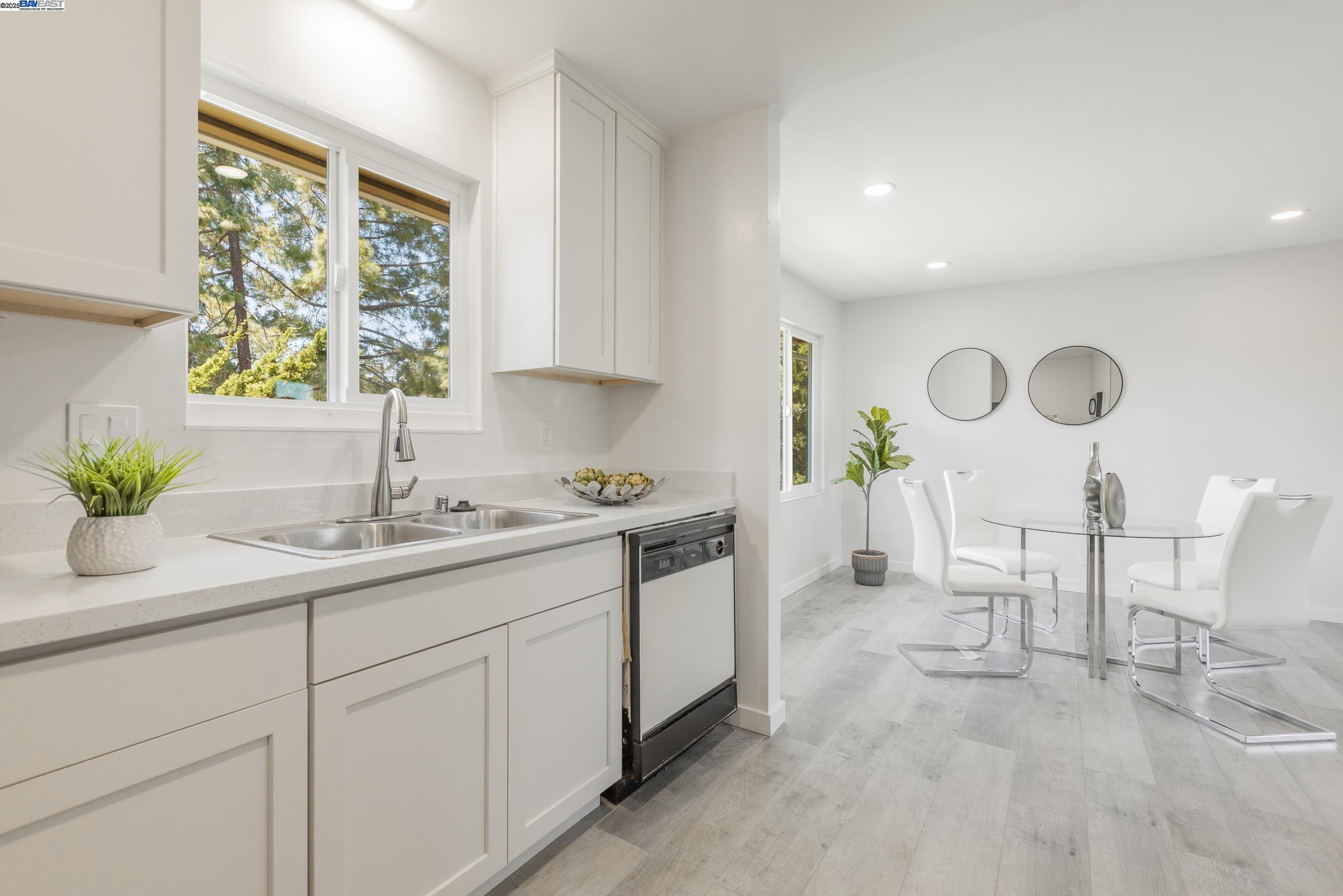 1965 Ascot Drive, Unit 6 Moraga, CA 94556 - Photo 5 of 25 a kitchen with a sink and cabinets