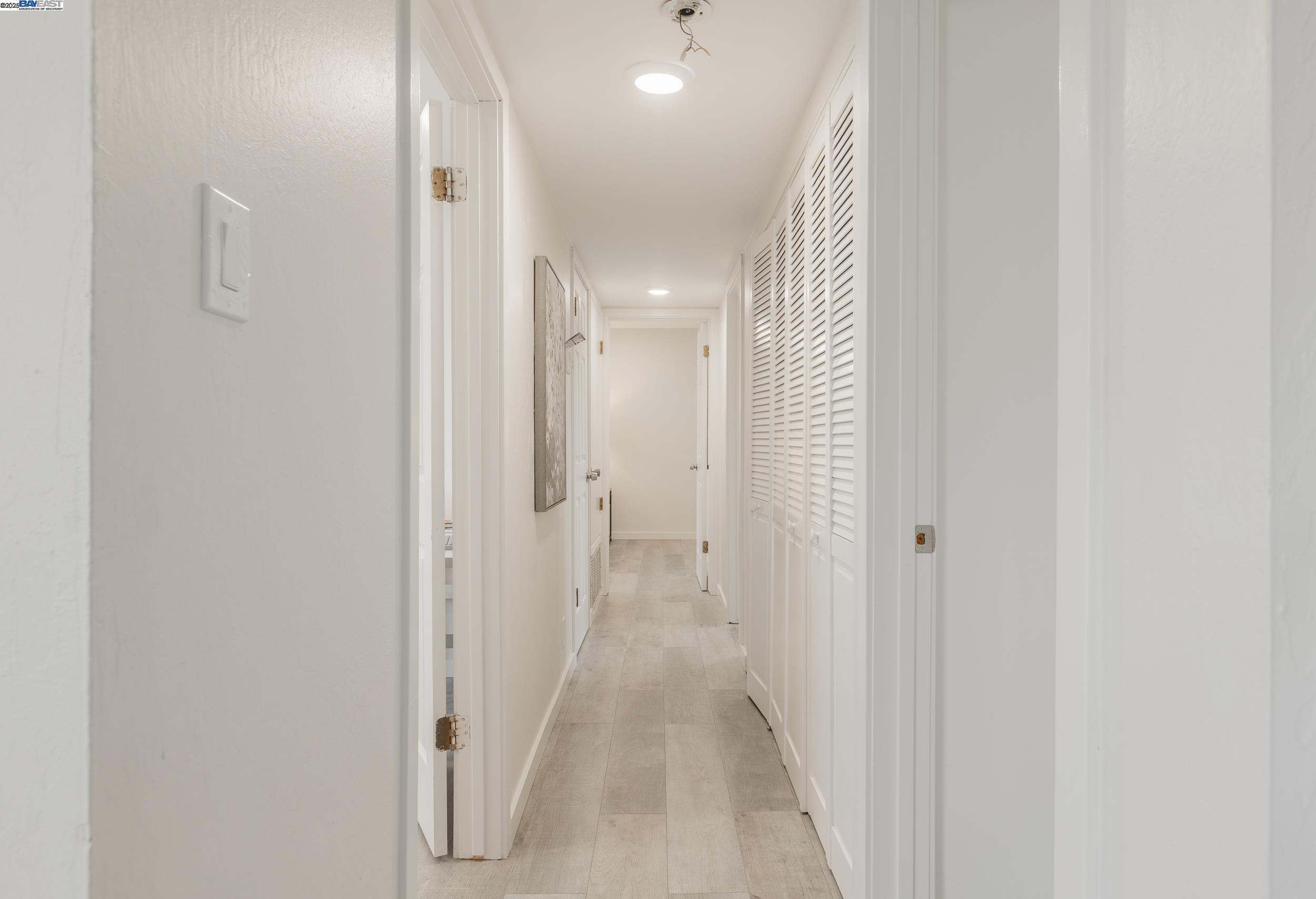 1965 Ascot Drive, Unit 6 Moraga, CA 94556 - Photo 6 of 25 a view of a hallway with wooden floor