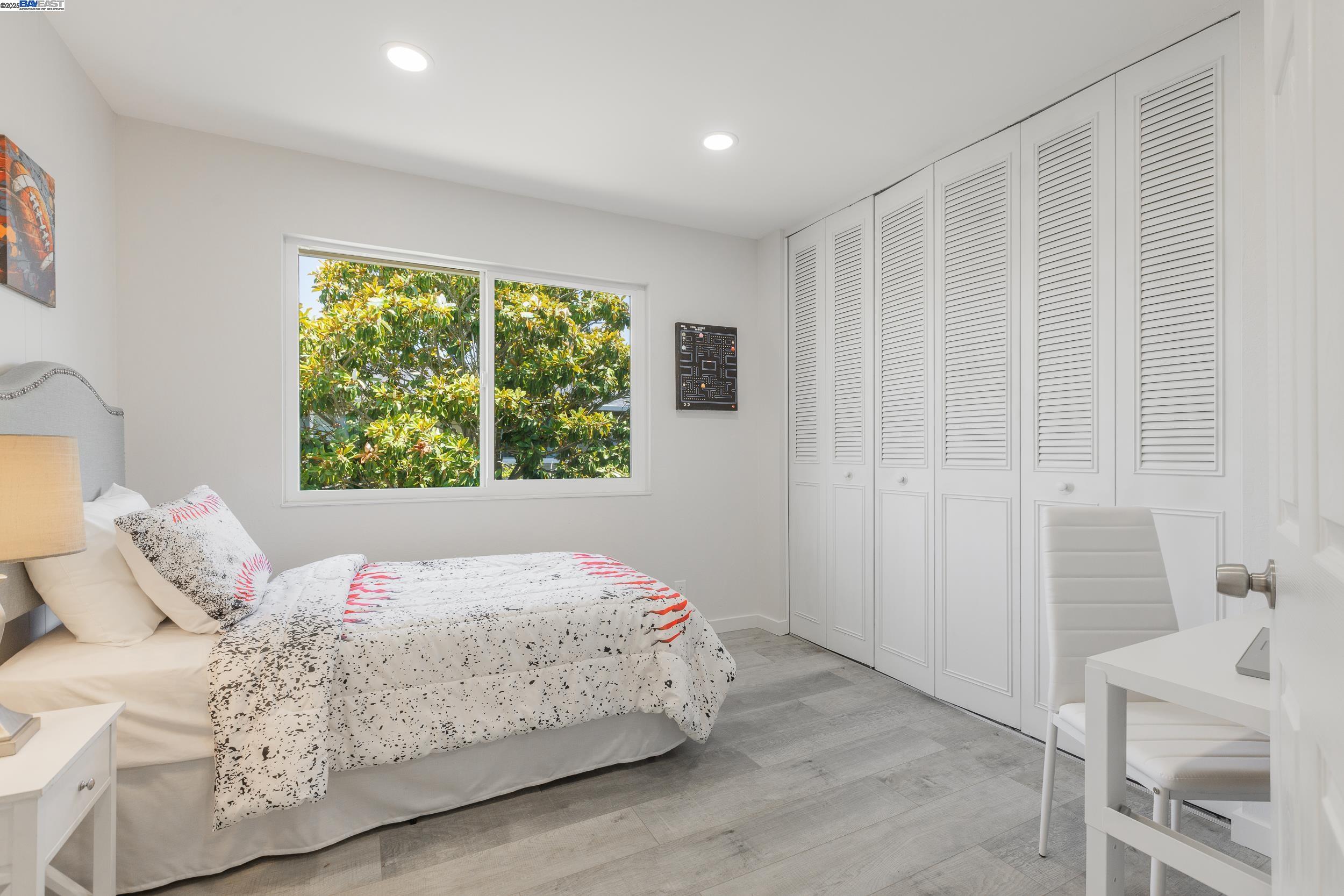 1965 Ascot Drive, Unit 6 Moraga, CA 94556 - Photo 7 of 25 a bedroom with a bed and a window