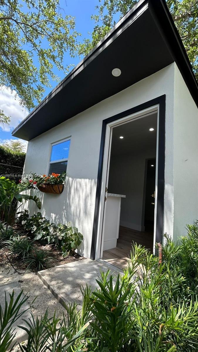 Miami-Dade County Miami, FL 33173 - Photo 4 of 11 a front view of a house with a yard