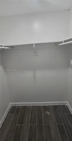 a view of a room with shelf on the wall