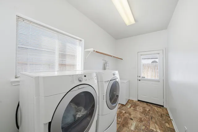 a view of livingroom with washer and dryer
