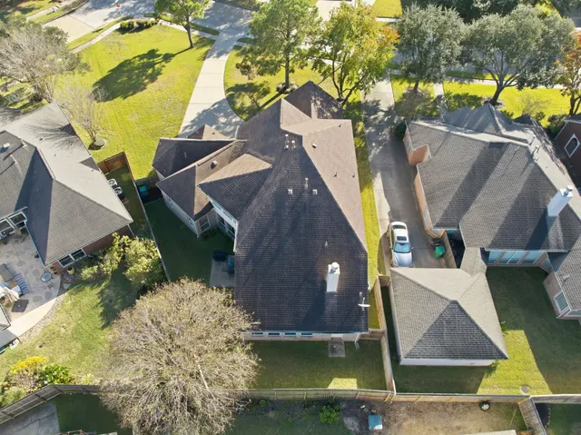 an aerial view of a house with swimming pool