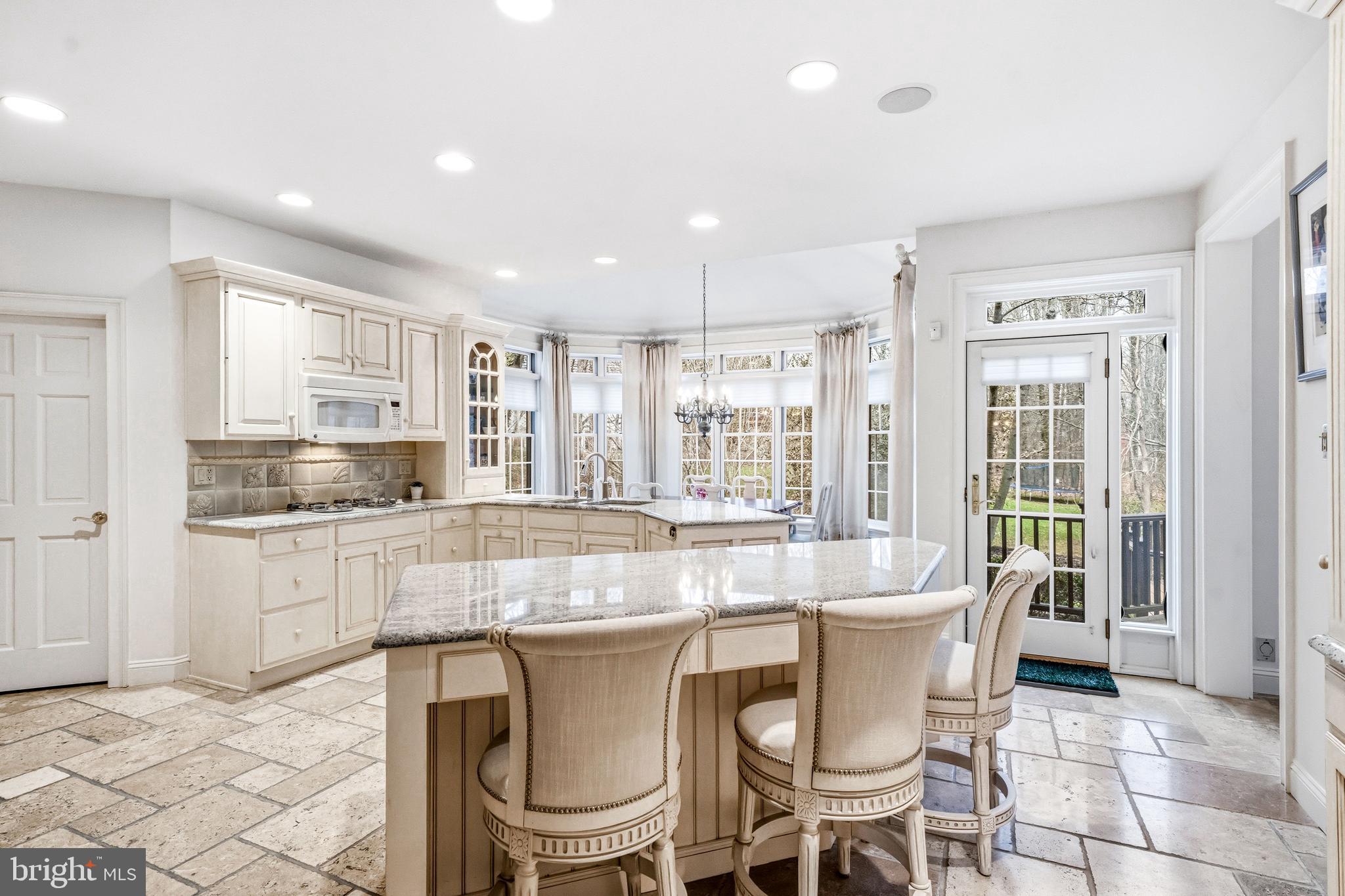 7 Mercer Gate Drive Doylestown, PA 18901 - Photo 12 of 44 a dining table with chairs and kitchen view