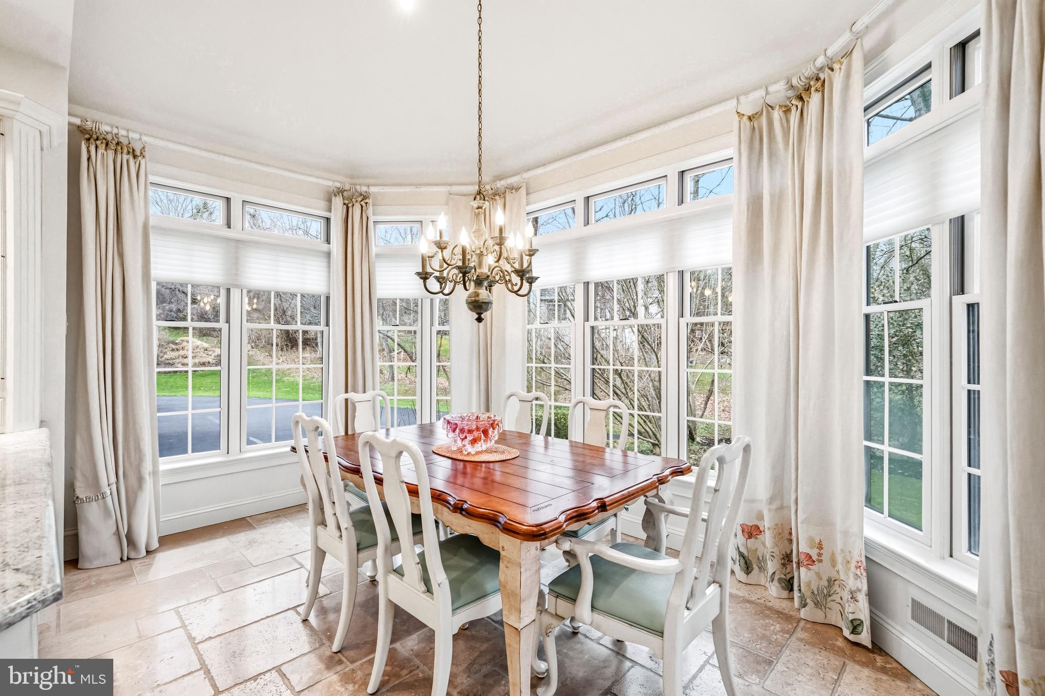7 Mercer Gate Drive Doylestown, PA 18901 - Photo 15 of 44 a view of a dining room with furniture large windows and wooden floor