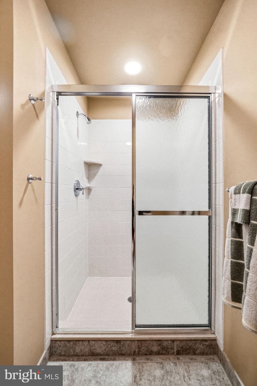 7 Mercer Gate Drive Doylestown, PA 18901 - Photo 27 of 44 a bathroom with a glass shower door