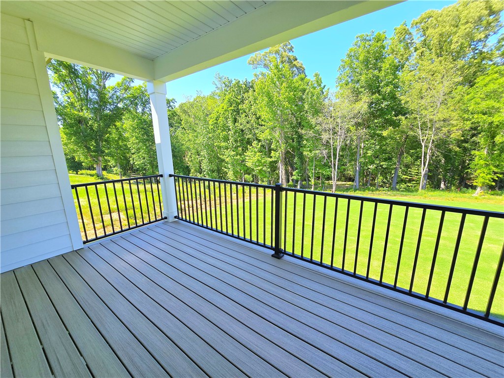 334 Summerall Drive Anderson, SC 29621 - Photo 17 of 28 This tranquil outdoor space offers expansive views of lush greenery, perfect for relaxation and enjoying nature.