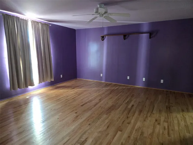 a view of a livingroom with wooden floor