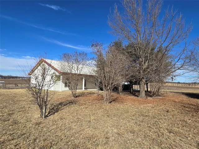 a view of a house with a snow in the yard