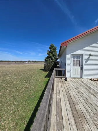 a view of a balcony with ocean view